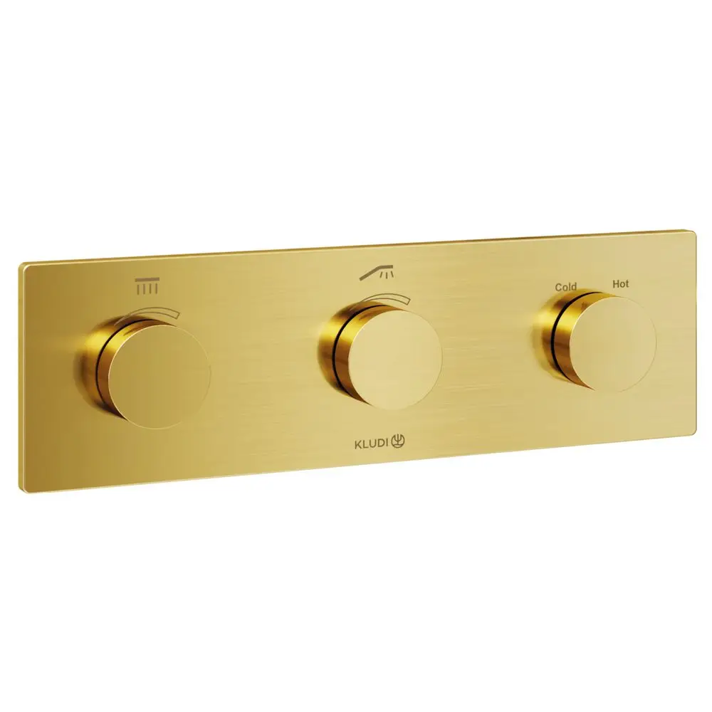 Drei kreisförmige Steuerknöpfe aus gebürstetem Gold auf einer flachen Platte, mit den Markierungen für Wasserfluss und Temperatur. Kludi-Logo in der unteren Ecke.